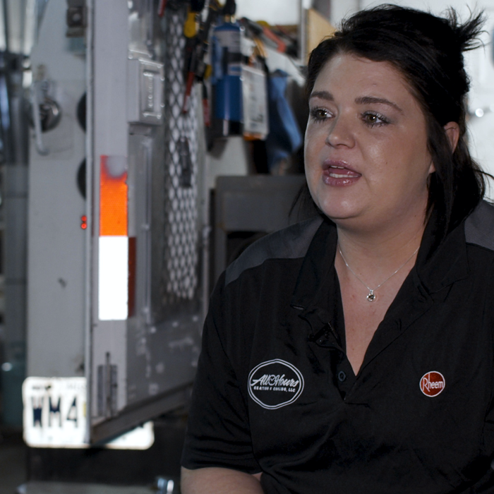 Woman HVAC technician preparing for the day